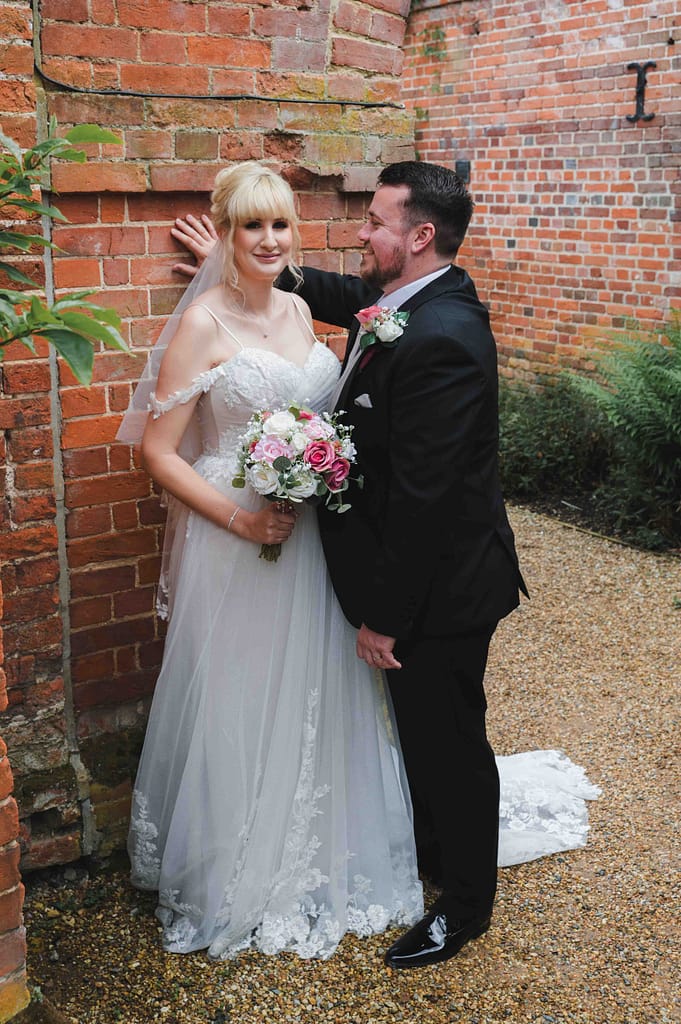 Bride & Groom in the gardens at Braxted Park Wedding Venue